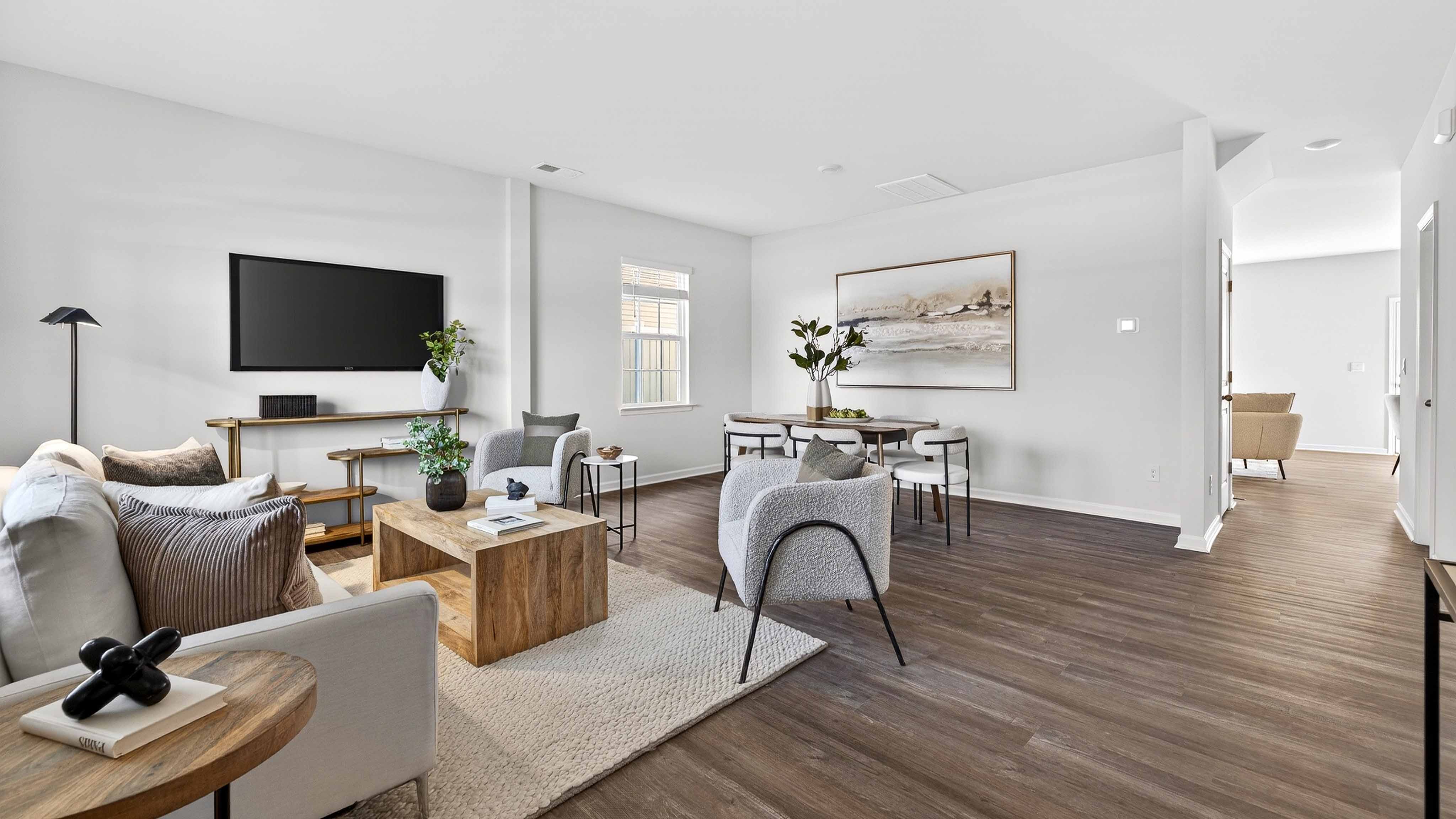 Spacious family room with large window and fireplace