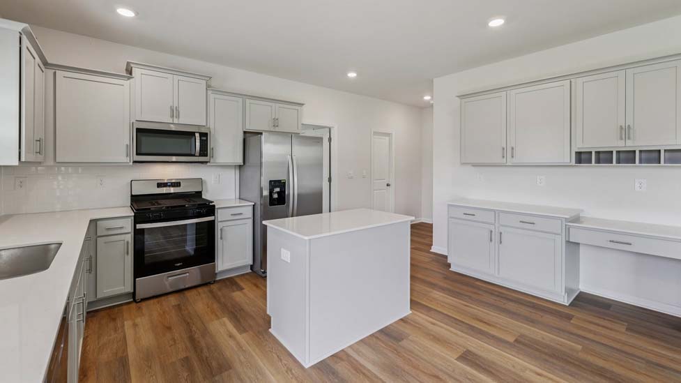 Kitchen with island, white cabinets