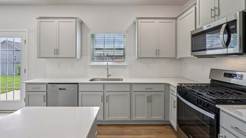 Kitchen with island, white cabinets