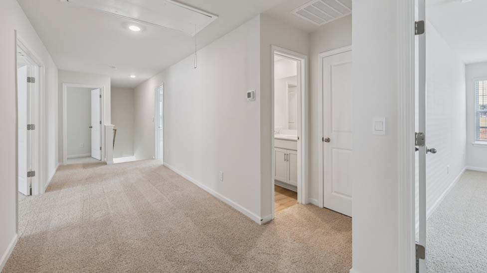 Carpeted bedroom with large window