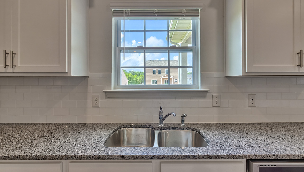 Kitchen with island, white cabinets