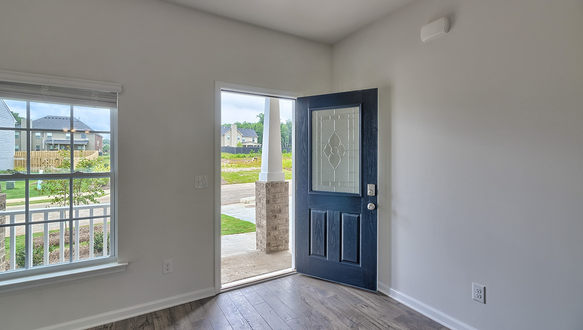 Welcoming entryway, open front door, large window