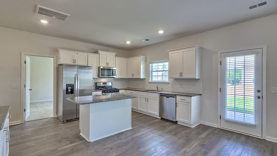 Kitchen with island, white cabinets