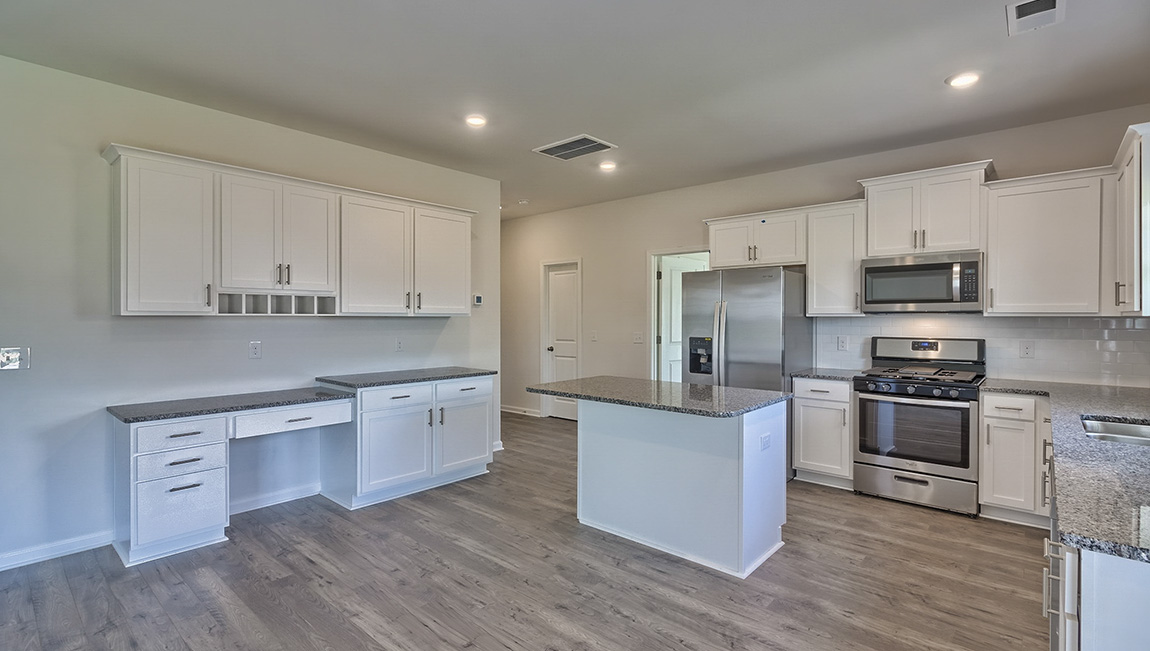 Kitchen with island, white cabinets