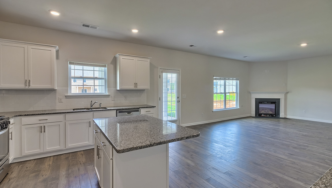 Kitchen with island, white cabinets