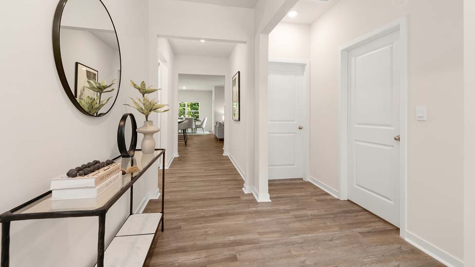 Welcoming foyer with vinyl flooring, view of interior. New Home in Charlotte, North Carolina