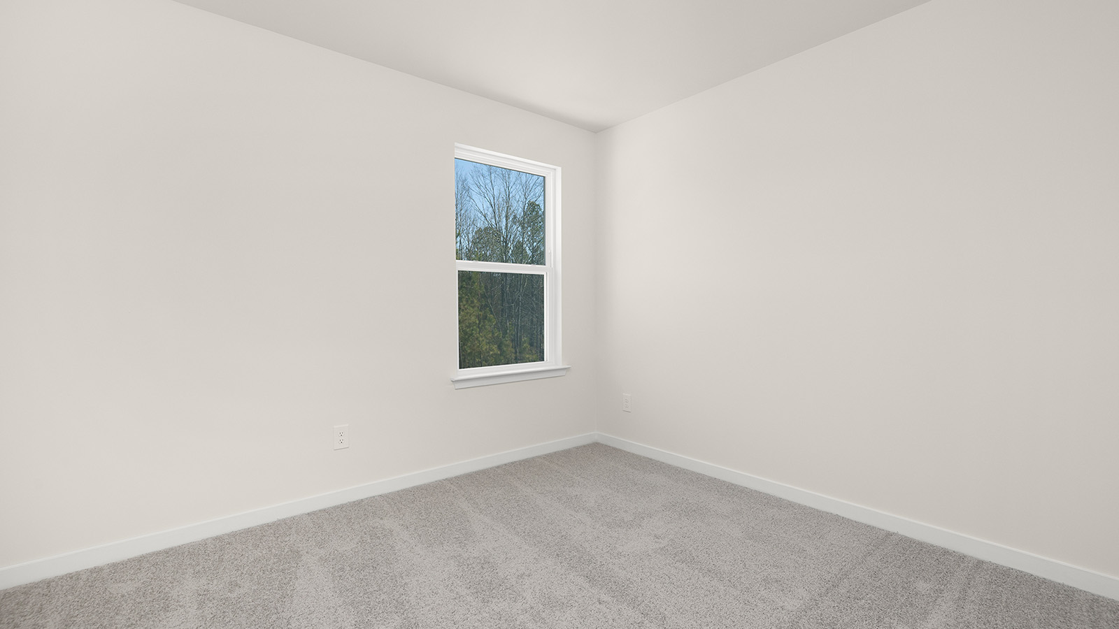 Carpeted bedroom with large window, view of bathroom door