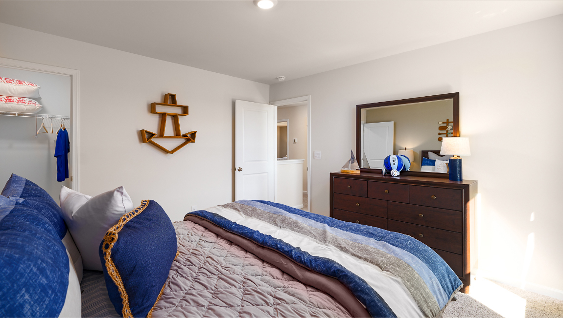 Carpeted bedroom with large window