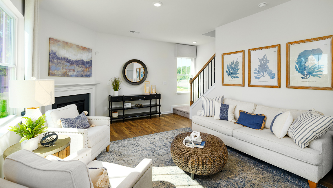 Open family room with fire place, vinyl floors, and large window