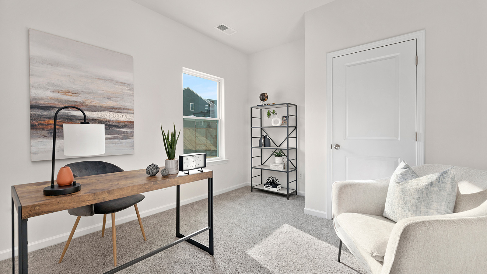Carpeted bedroom with large window