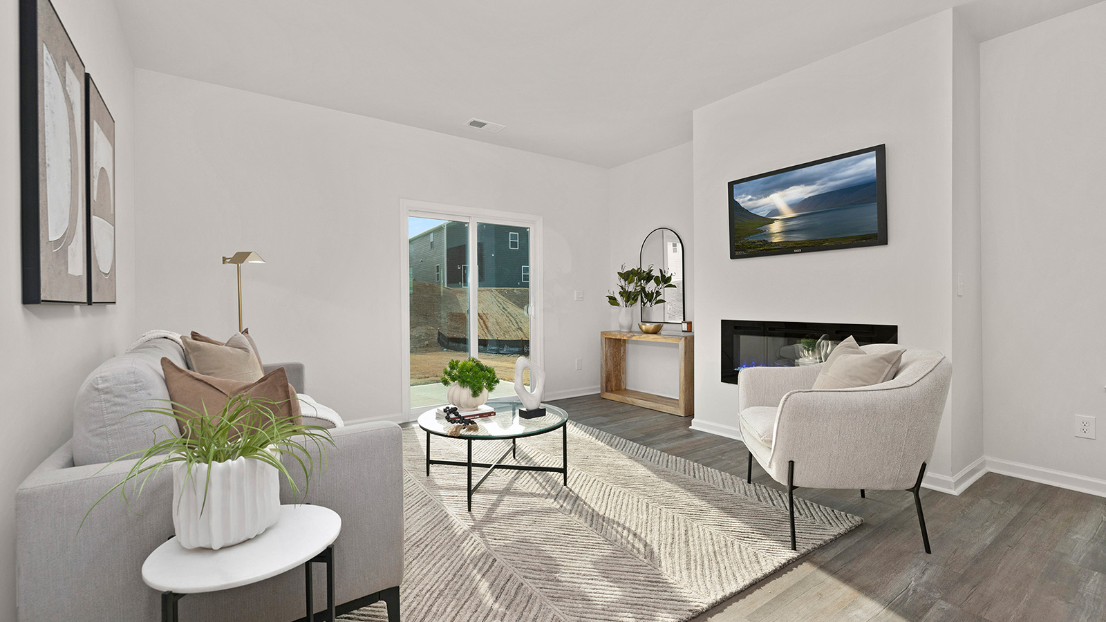 Family room with fireplace and large window