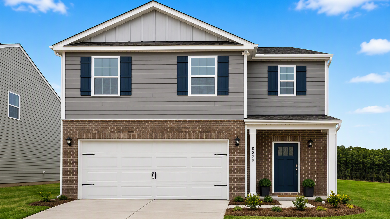 Robie front exterior representative photo with brick and siding