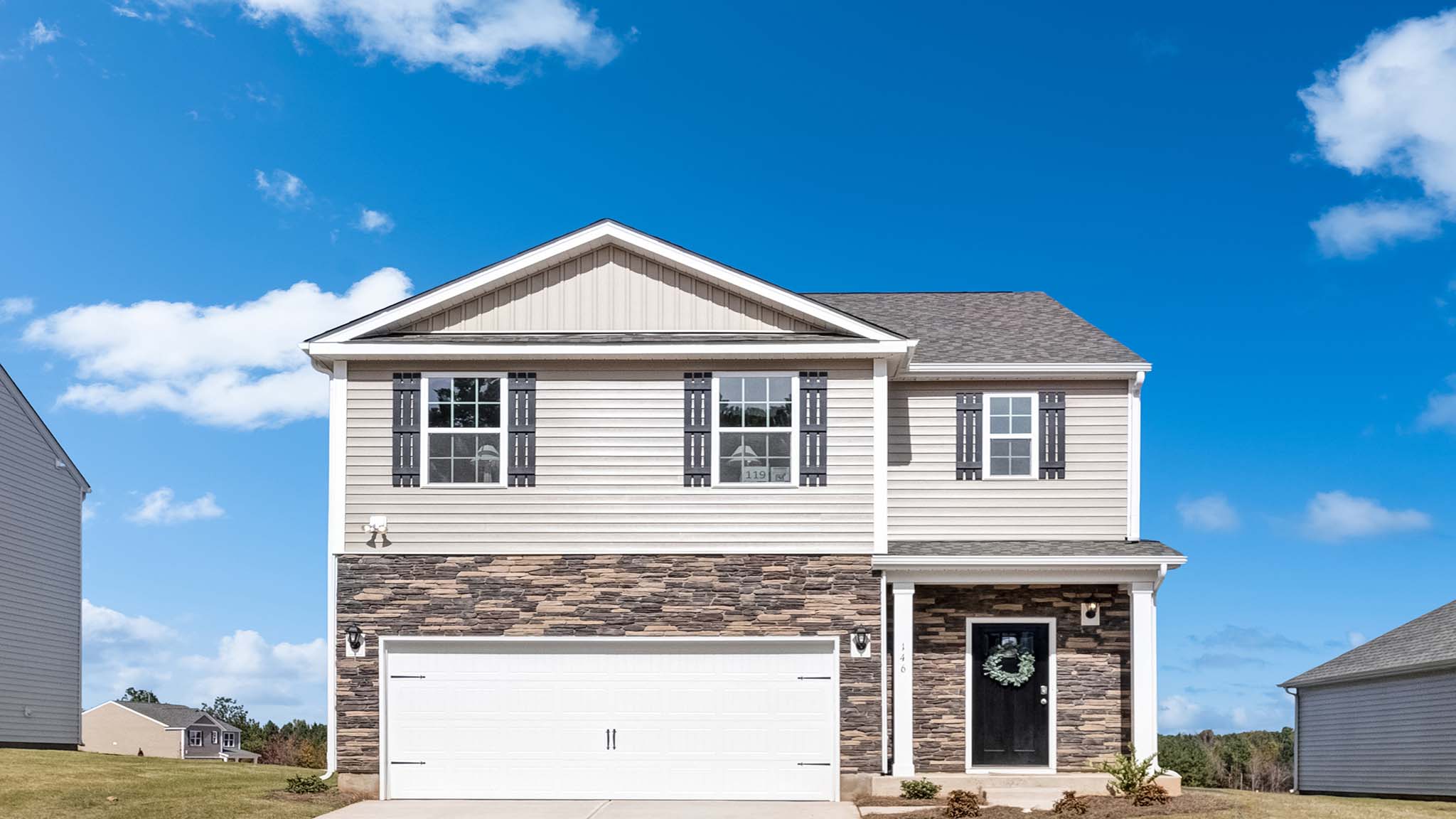 Robie front exterior representative photo with brick and siding