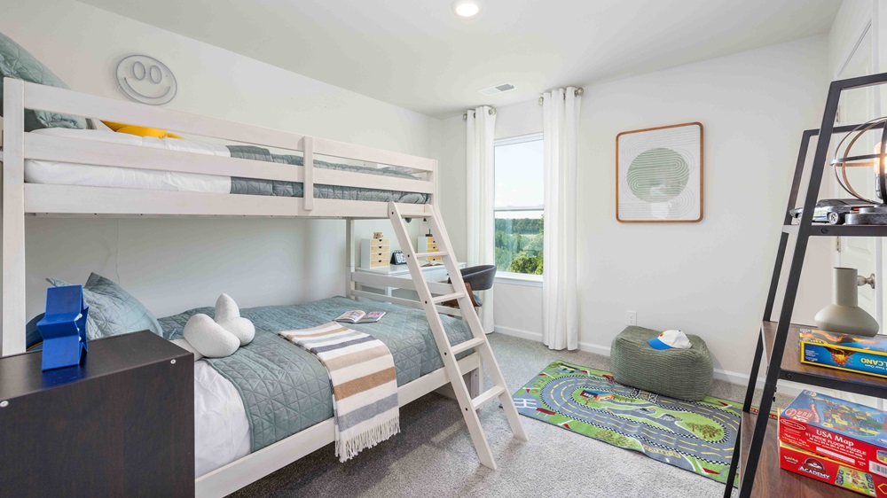 Carpeted bedroom with large window, view of bathroom door
