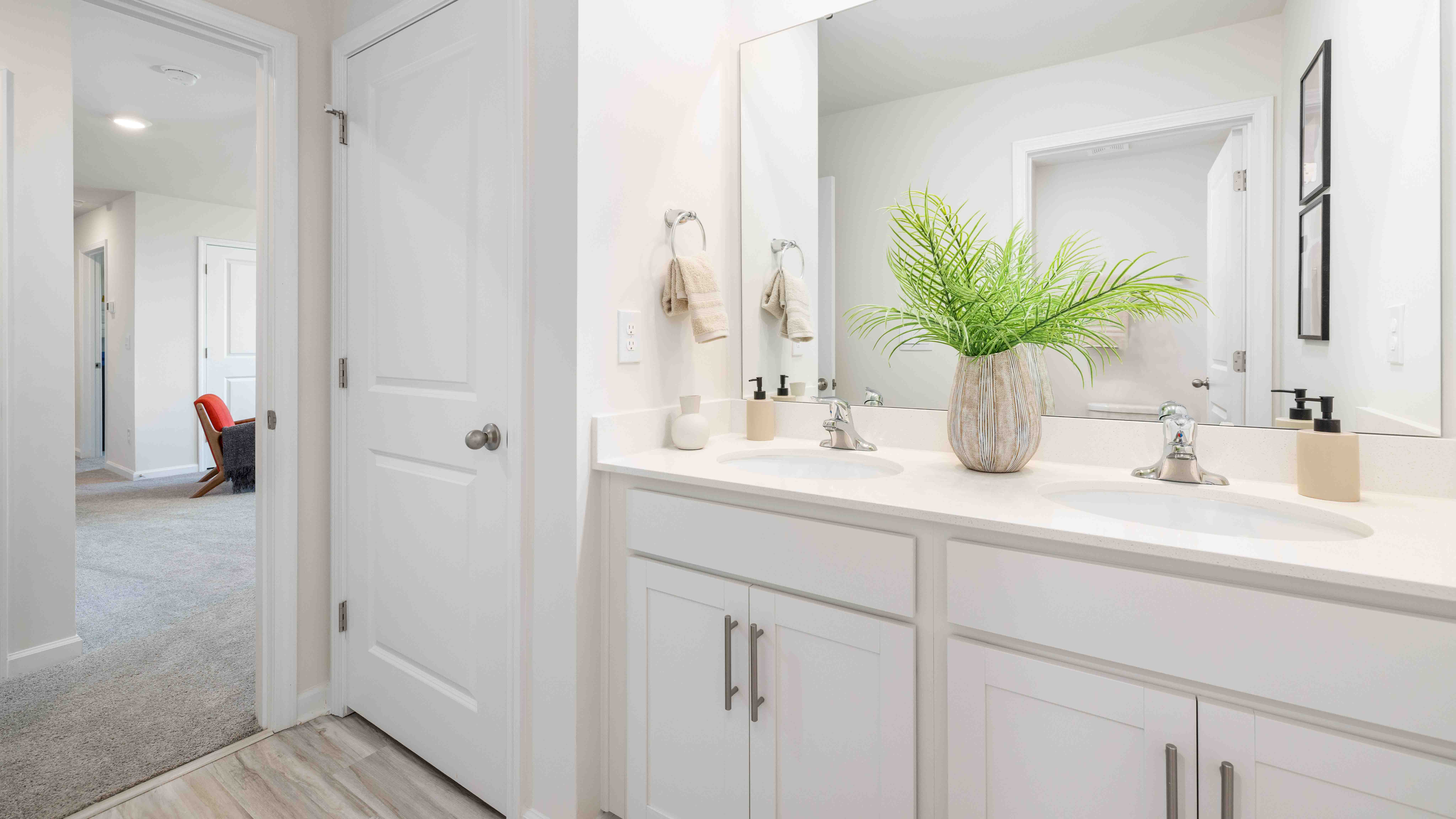 Bathroom with double sinks and tub shower