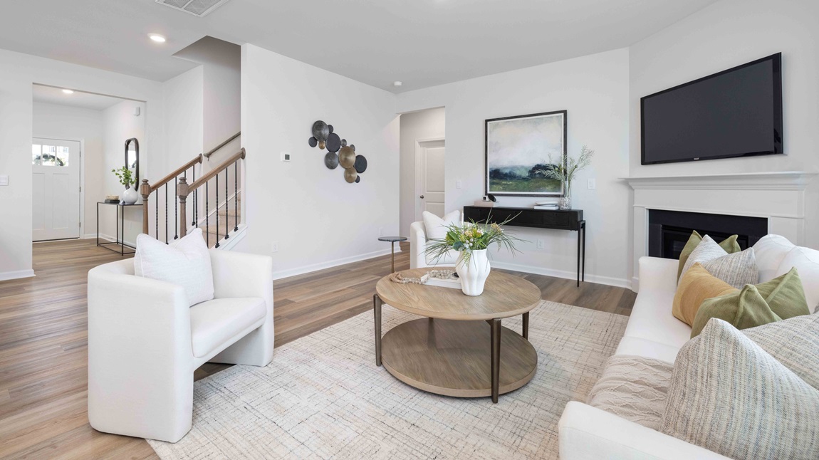 living room with fireplace and large windows