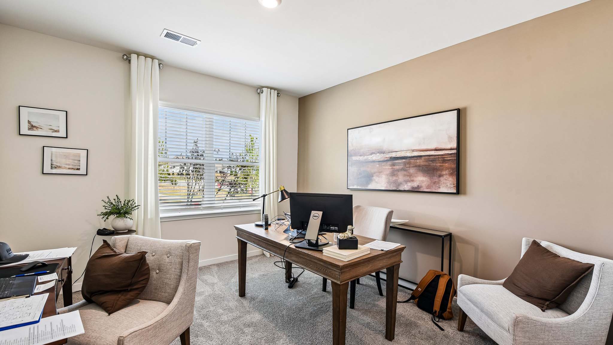 Carpeted bedroom with windows