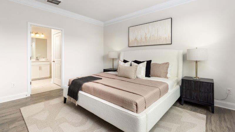 Brookside Arlington primary bedroom, carpeted with view of bathroom