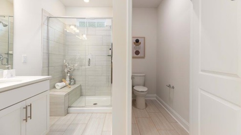 Brookside Arlington primary bathroom with glass door shower