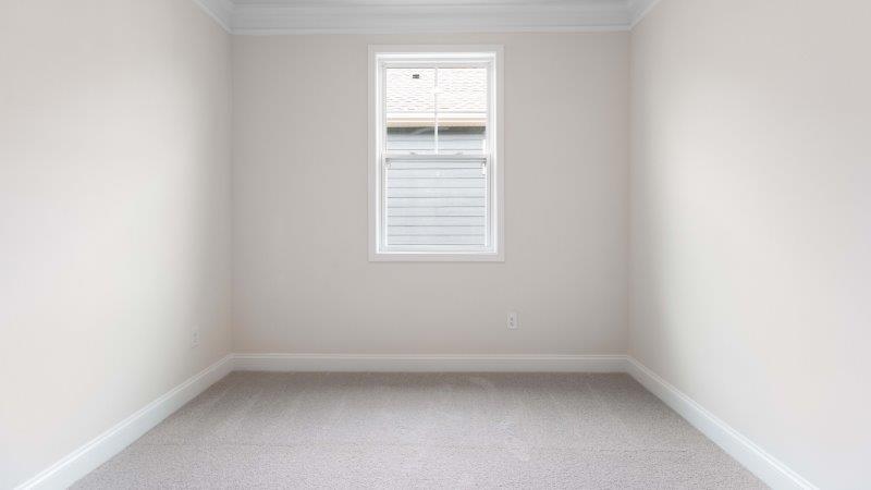 Brookside Arlington carpeted bedroom with small window