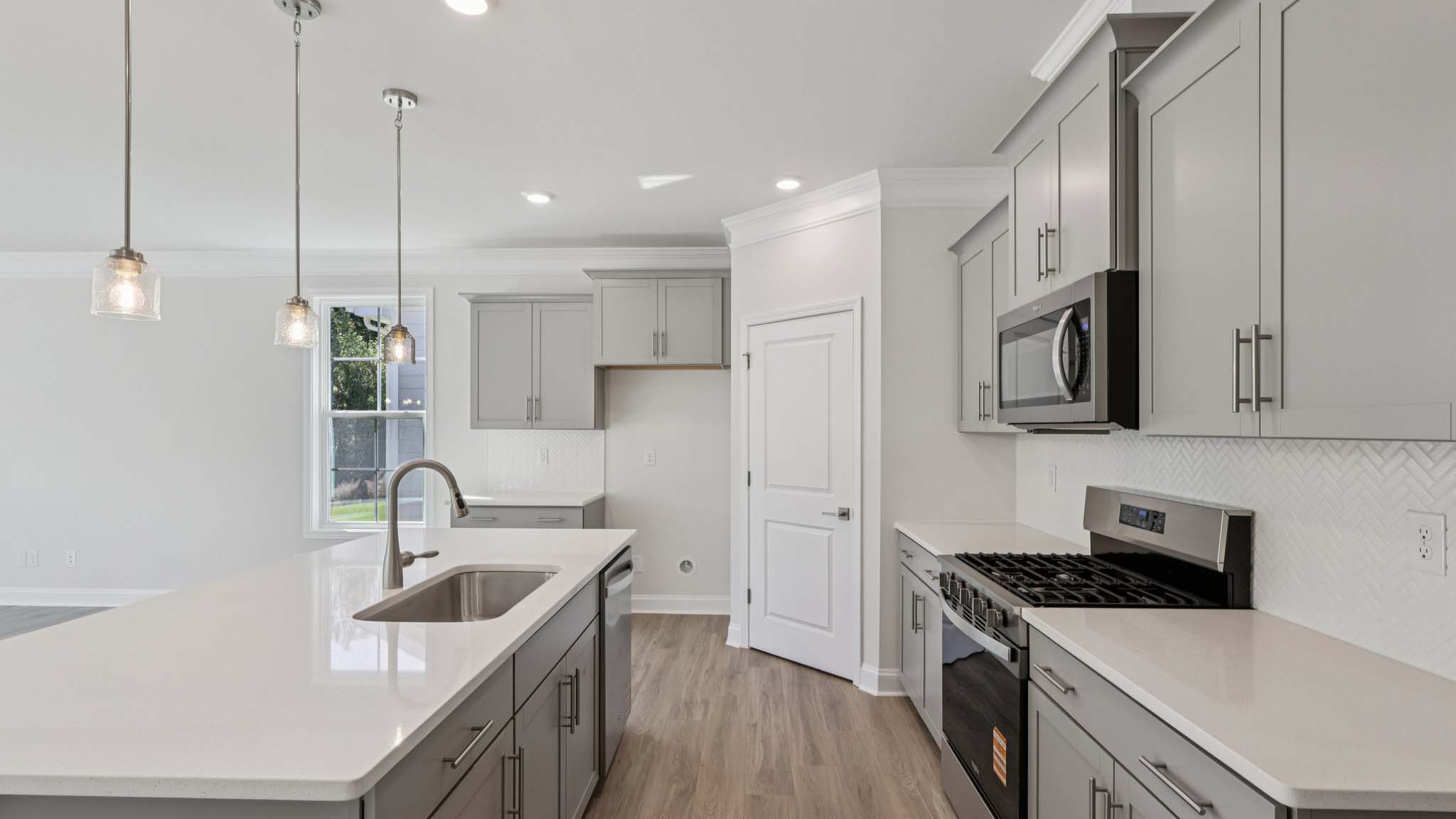 kitchen and island with stainless steel appliances