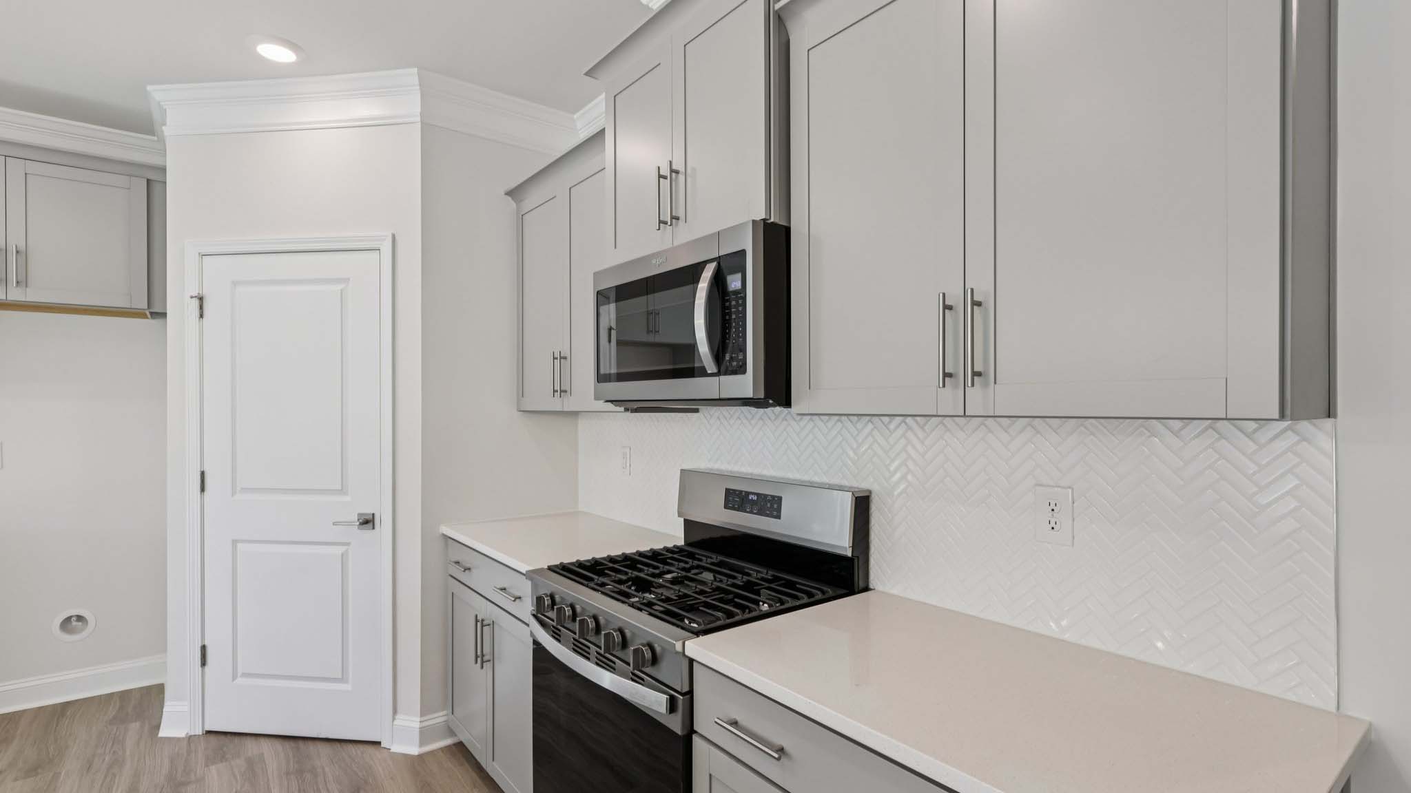 kitchen and island with stainless steel appliances