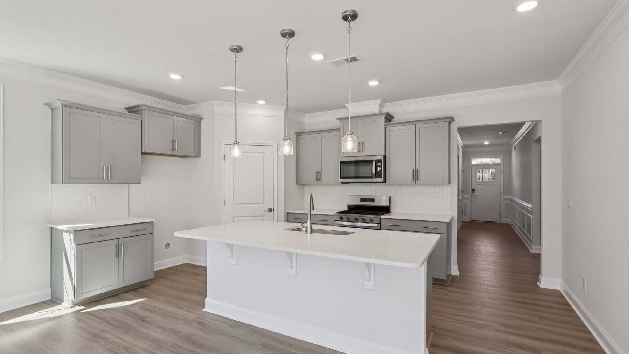 kitchen and island with stainless steel appliances