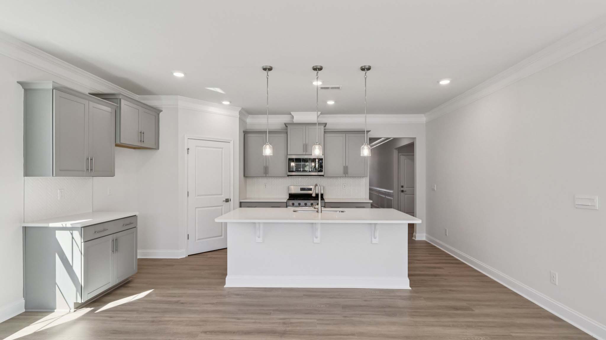kitchen and island with stainless steel appliances