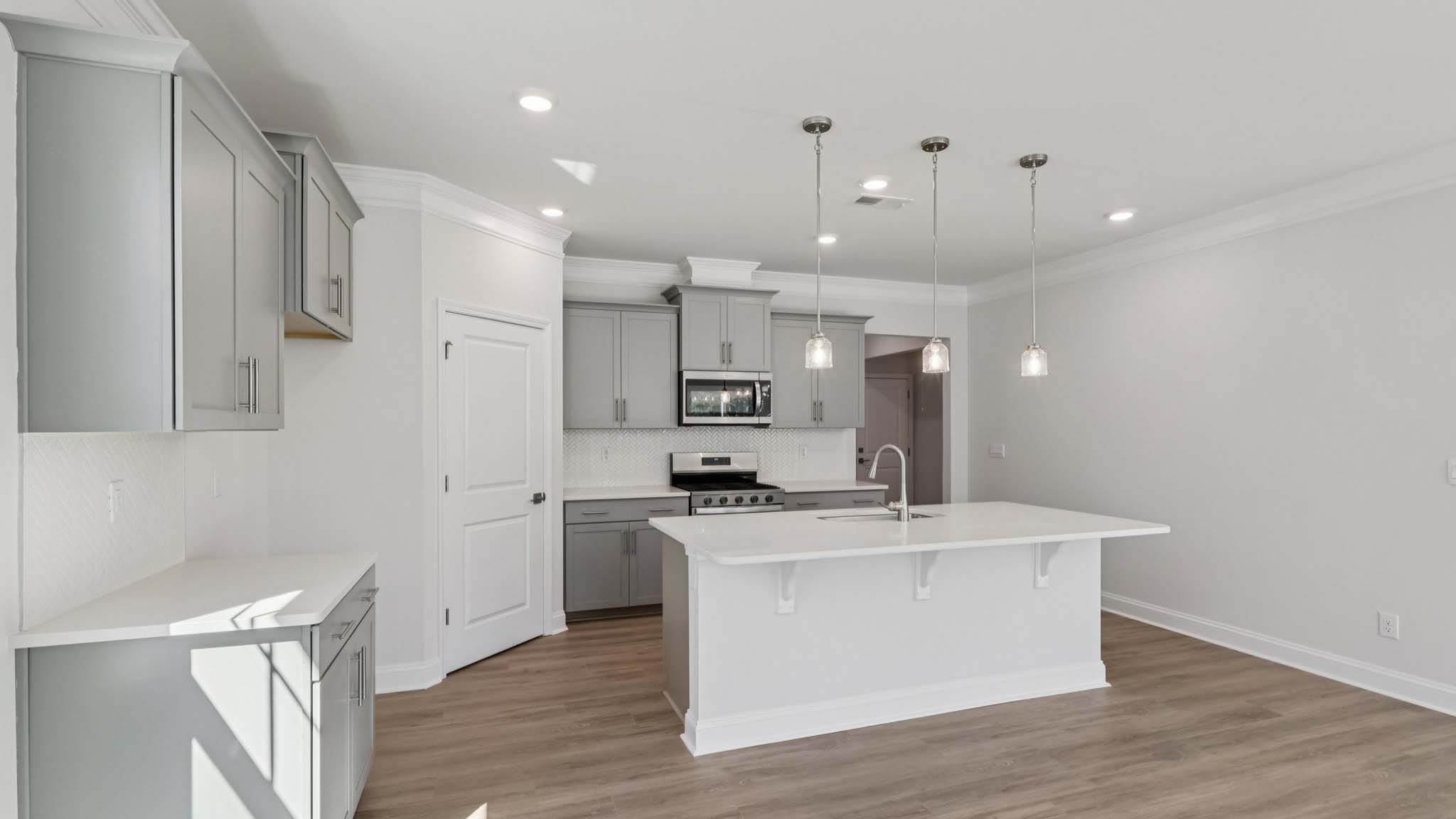 kitchen and island with stainless steel appliances