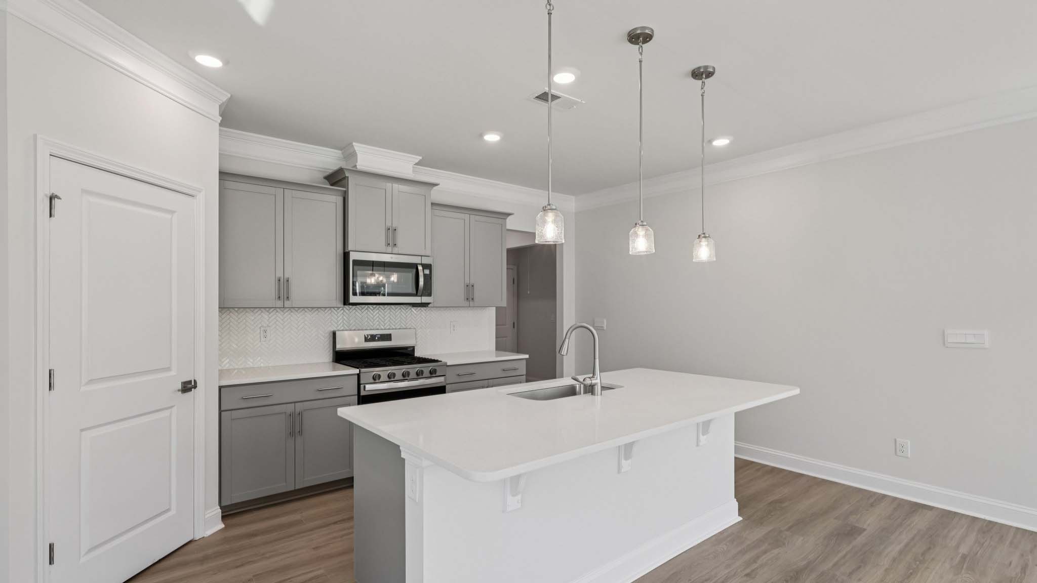 kitchen and island with stainless steel appliances