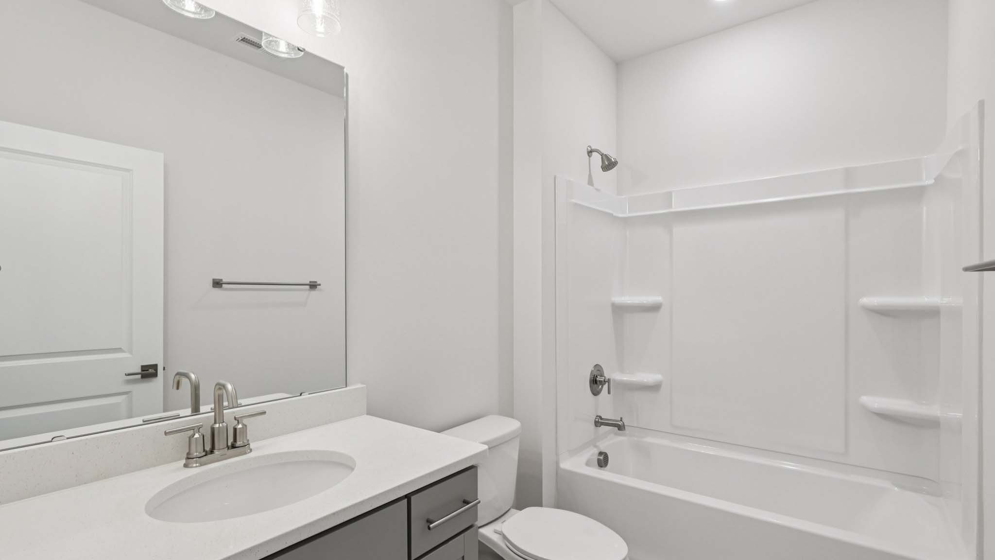 bathroom with bathtub shower combo