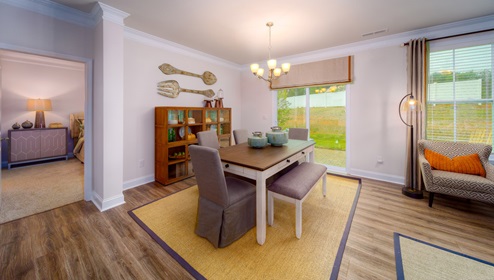 Dining area with wood floors, and sliding glass doors