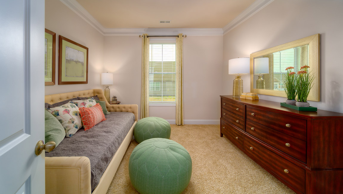 Carpeted bedroom with large window