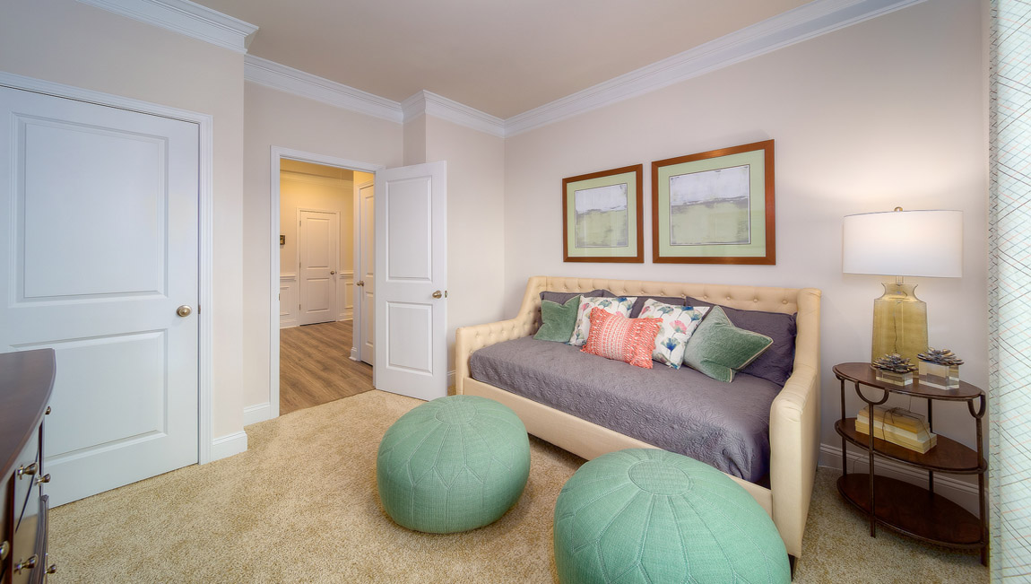 Carpeted bedroom with large window