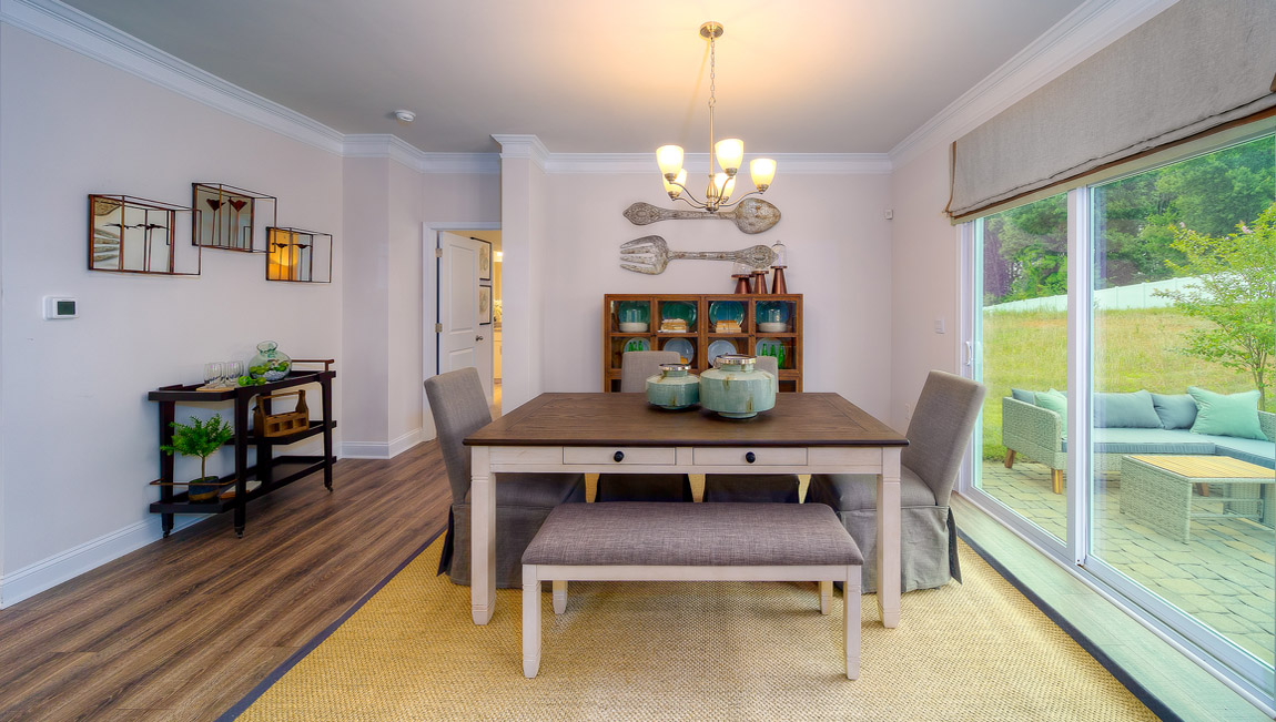 Dining area with wood floors, and sliding glass doors