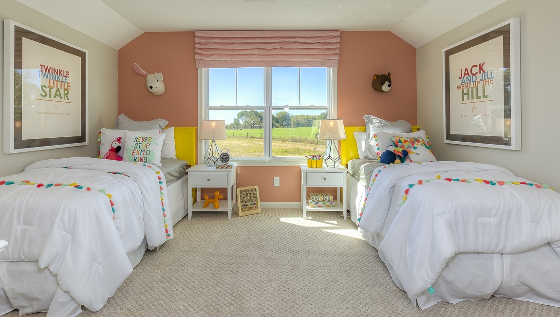 Carpeted bedroom with large windows