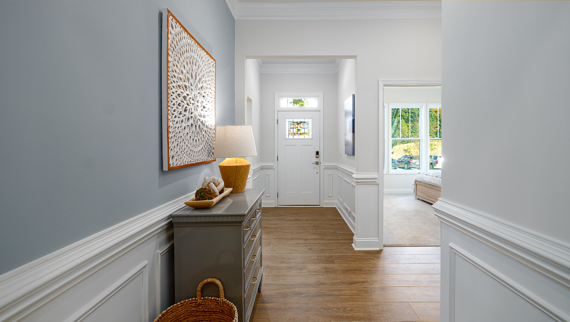 Welcoming foyer with wood floors