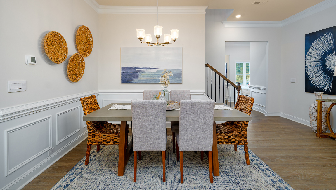 Dining area with wood floors and view of foyer