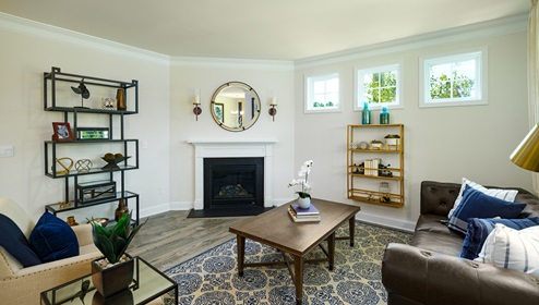 Living room space with large window and fireplace