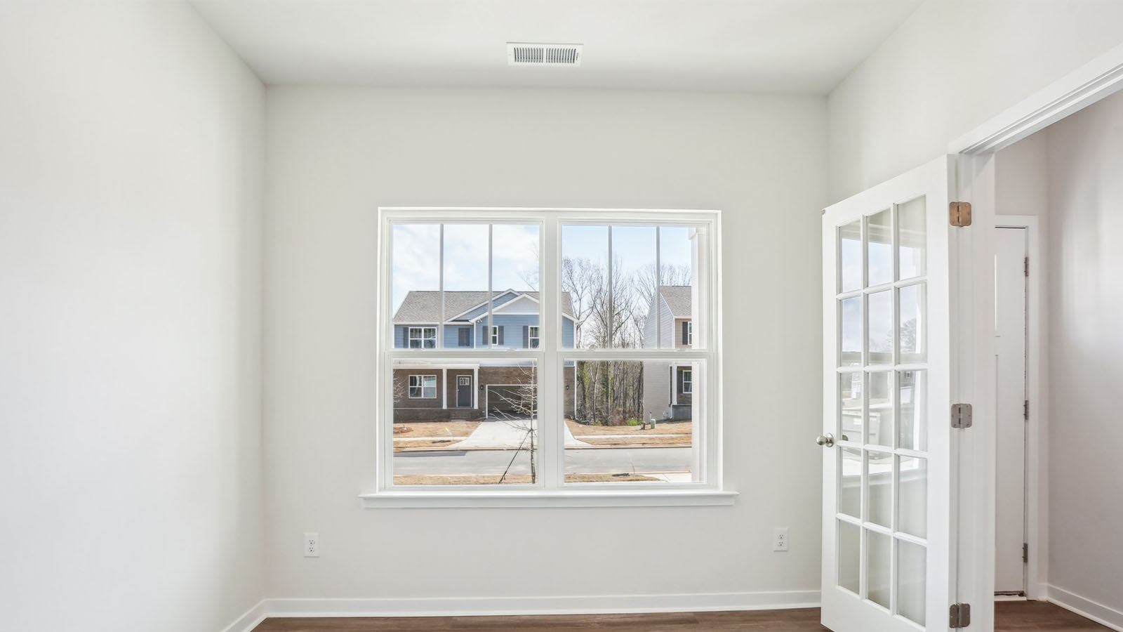 Flex or dining room with french doors and large window