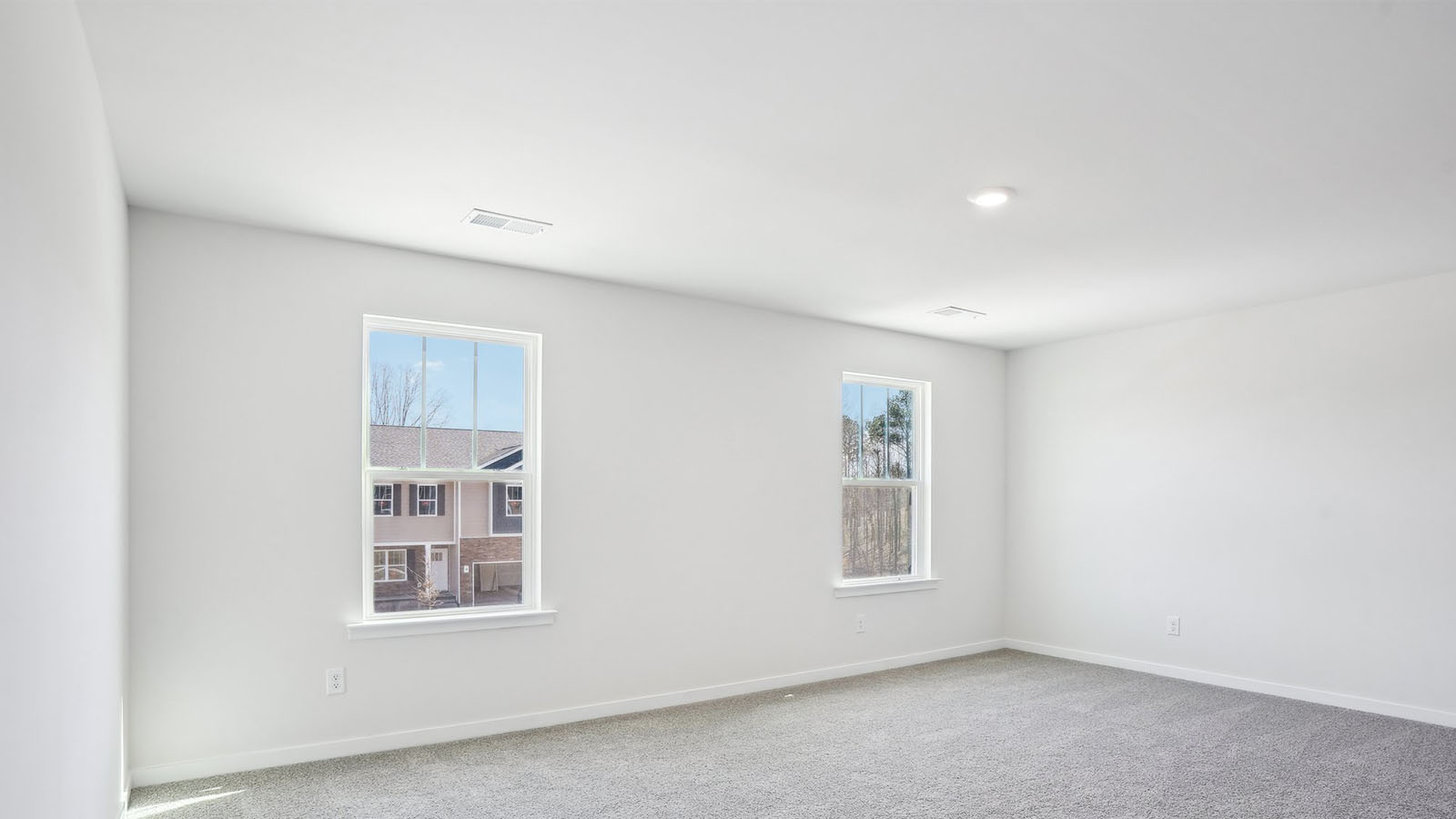 Carpeted bedroom with  window