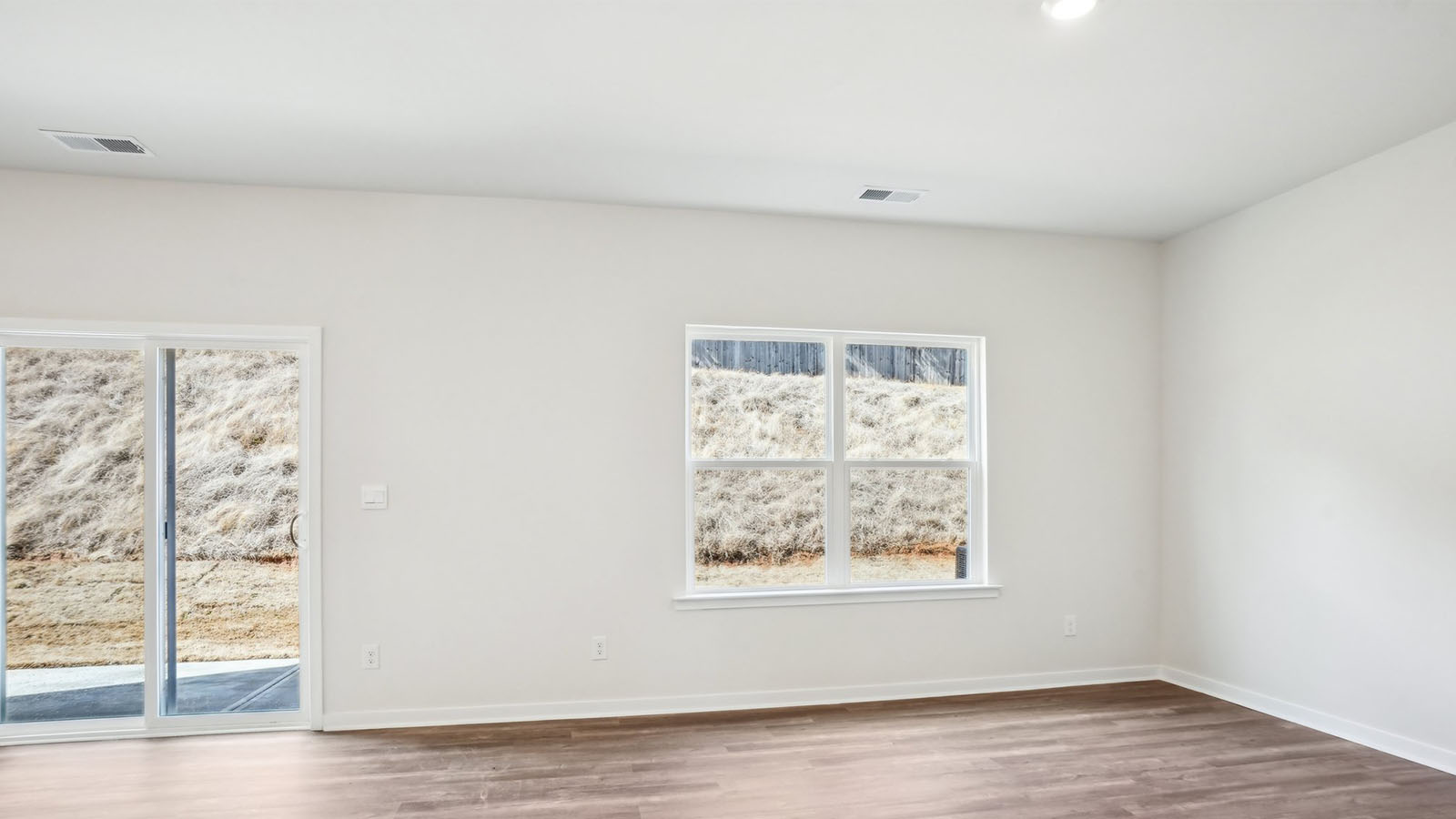 Living room with large window and electric fireplace
