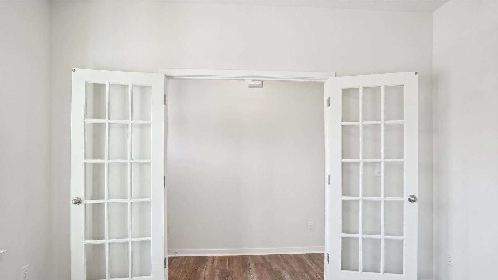 Flex or dining room with french doors and large window