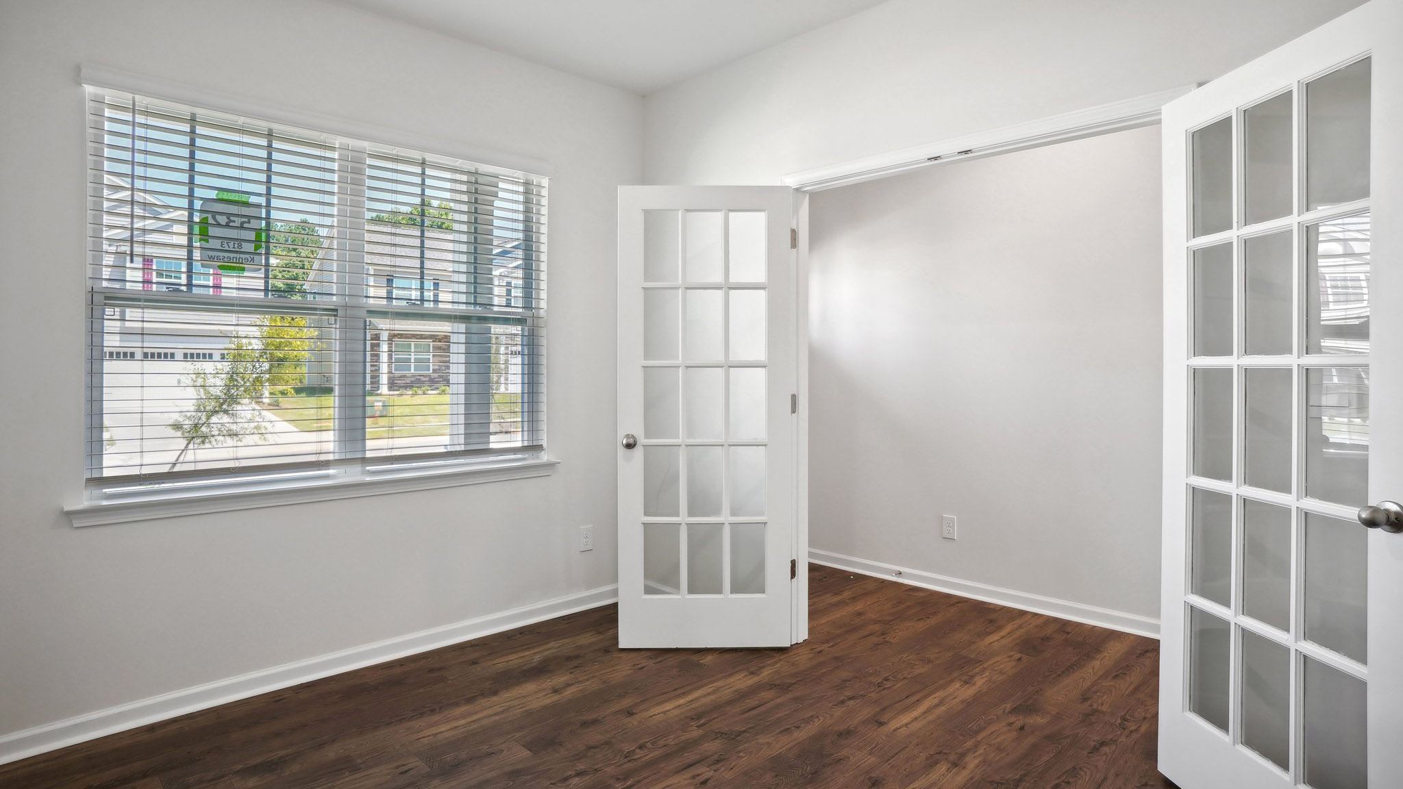 Flex or dining room with french doors and large window