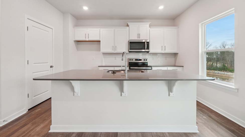 Kicthen and island with stainless steel appliances