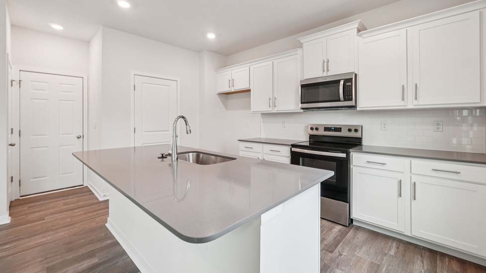 Kicthen and island with stainless steel appliances