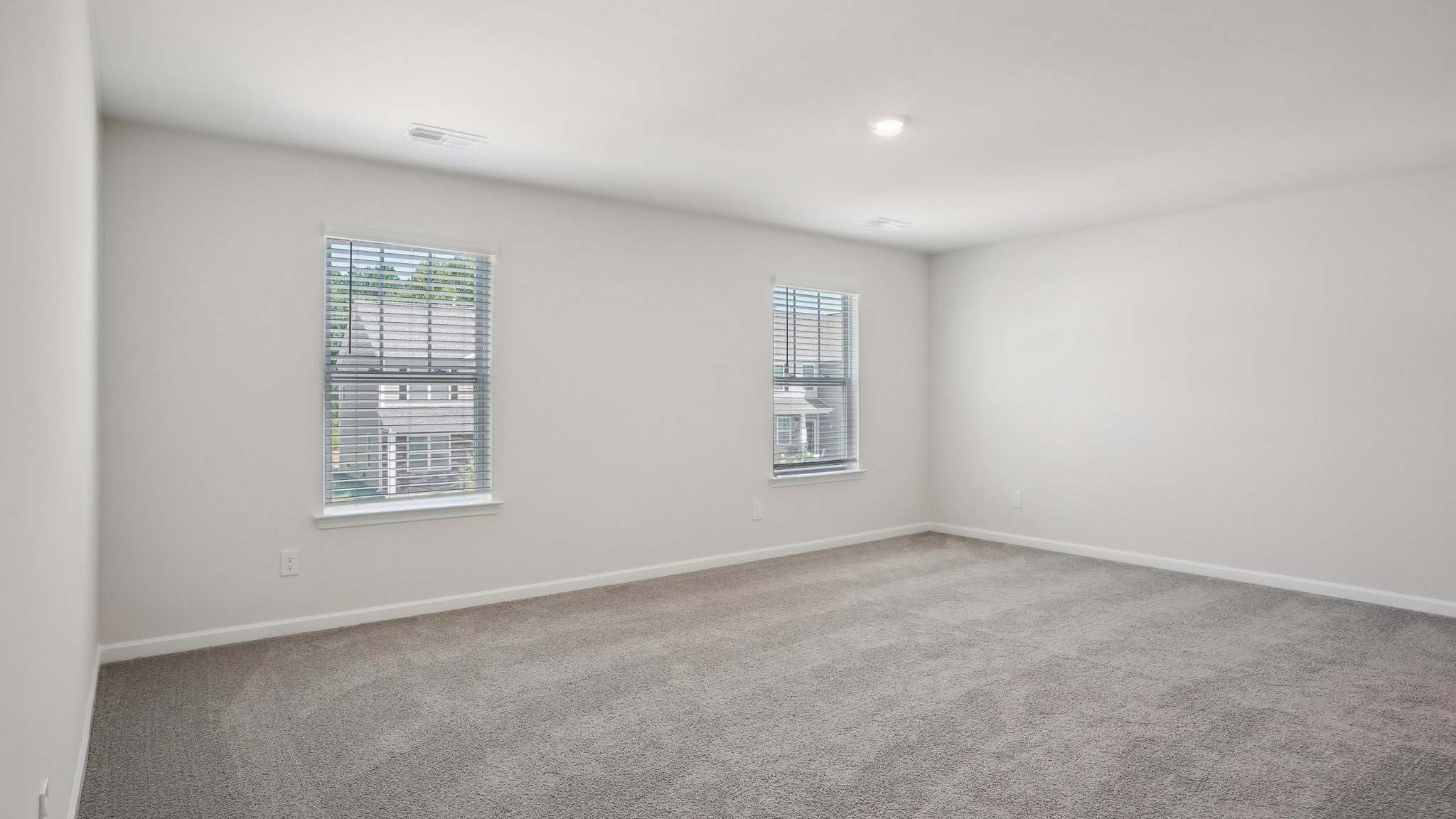 Carpeted bedroom with  window