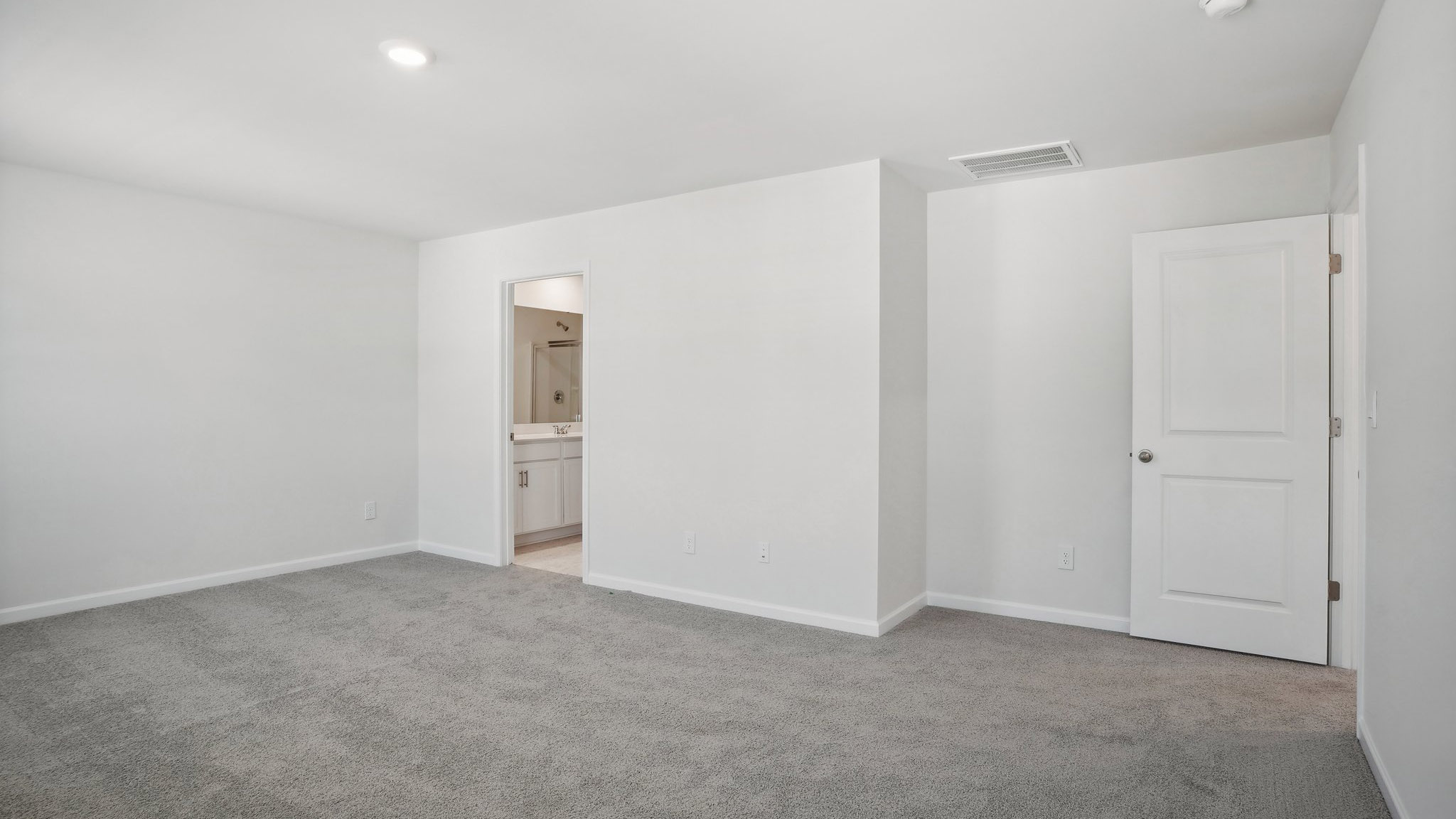 Carpeted bedroom with  window