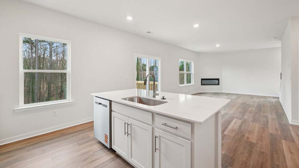 Kitchen and island with stainless steel appliances