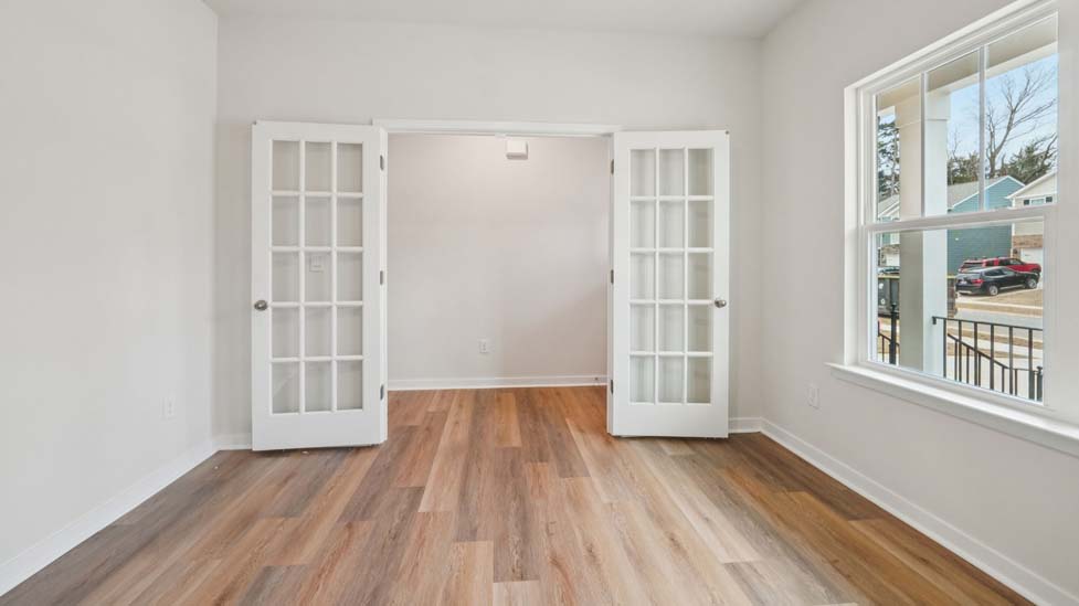 dining room with large window and french doors